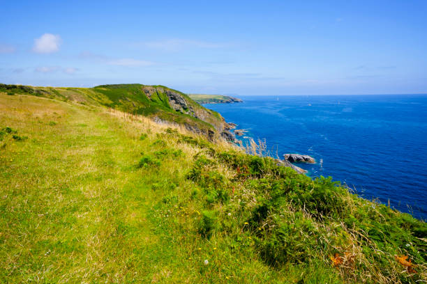 istock Across the grass covered cliff tops of St. Anthony Head in Cornwall. 2173984084