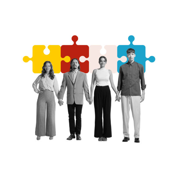istock Four employees holding hands in front of puzzle pieces, symbolizing cohesiveness, unity, collaboration. Contemporary art collage. 2173986792