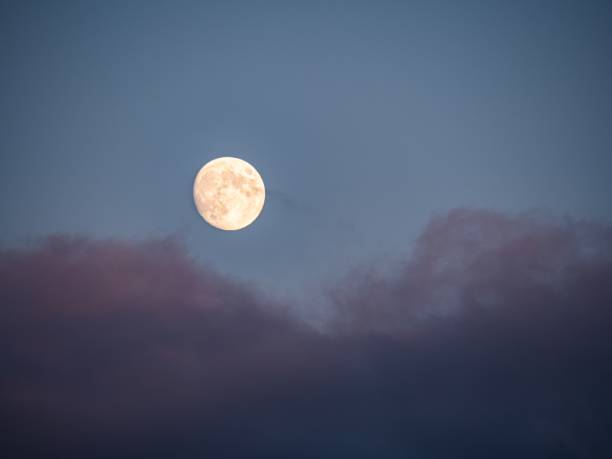 istock Full Moon in Night Sky with Gentle Clouds 2173987417