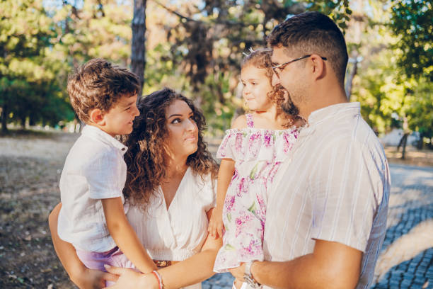 istock Mom and dad with children 2173988336