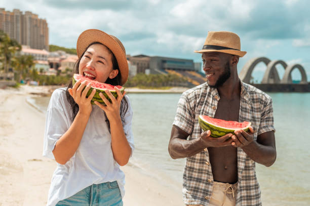 istock Joyful Beach Day with Watermelon Feast 2173988630