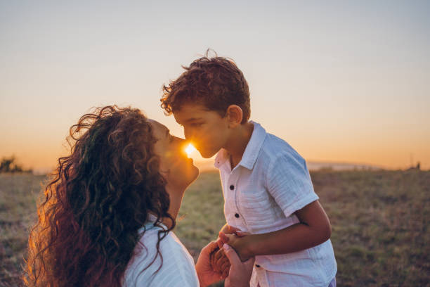 A Mother and child son over white background