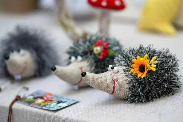 Cute decorative hedgehogs made from natural materials with floral accents.