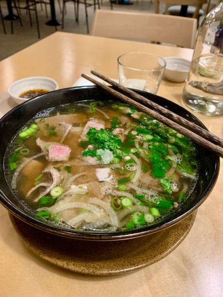 Pho Vietnamese Noodle Soup with bone broth and fresh condiments