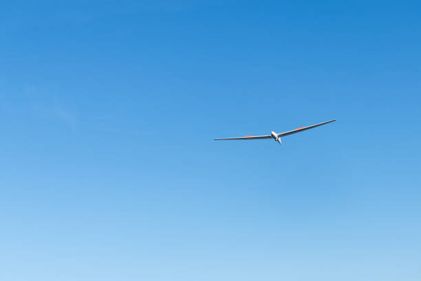 istock A glider flying against a clear blue sky - moments before landing 2173991718