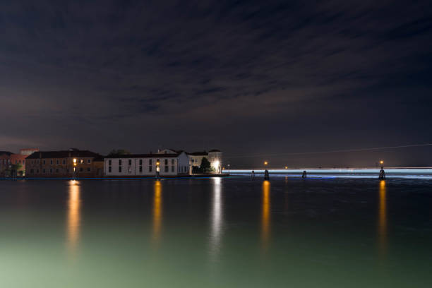 Long exposure of the venice lagoon at night with light trails from passing boats