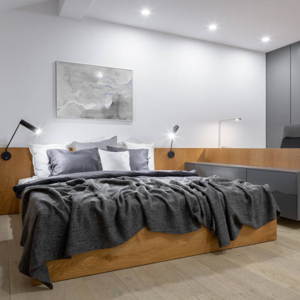 istock Stylish bedroom with wooden elements 2173997293