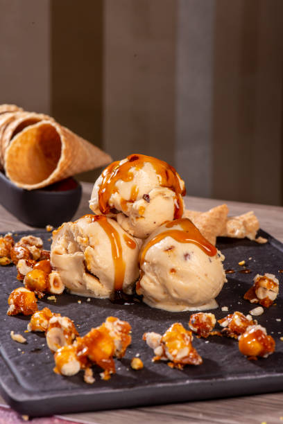istock peanut brittle icecream is in balck dish on table vertical icecream still 2173997835