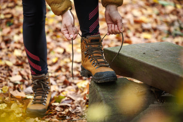 istock Woman tying shoelace on her hiking boot 2173997990