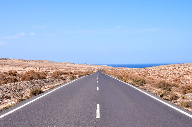 istock A long, empty road stretches out into the distance 2174000069