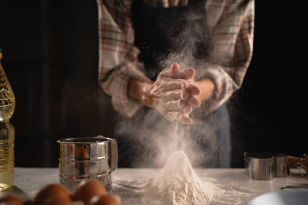 istock Before baking, its essential to dust flour on the kitchen counter for preparation 2174000384