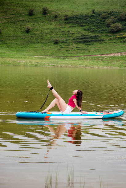 istock Woman on paddle board, relax. Water sport 2174000684