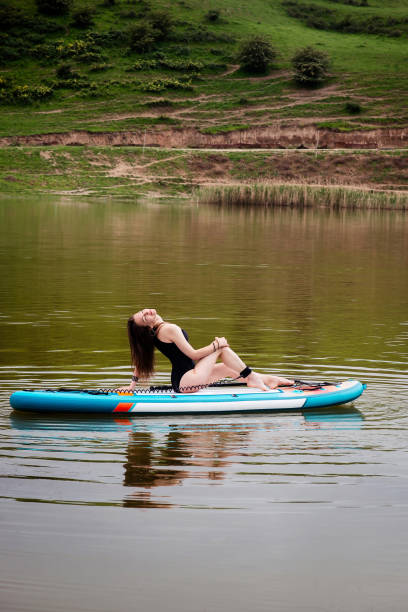 istock Sensual Woman with paddle board, sporty lifestyle. 2174000722