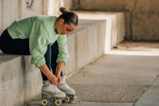 istock skater putting on skates for training 2174000960