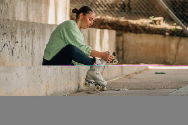 istock skater putting on skates for training 2174000967