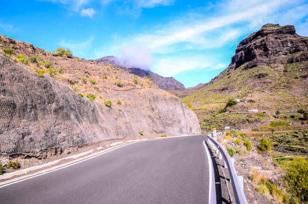 istock A road with a mountain in the background 2174001360