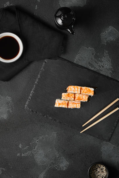 istock Delicious Shrimp and Cucumber Roll on Elegant Slate Plate with Modern Minimalist Setting 2174001816