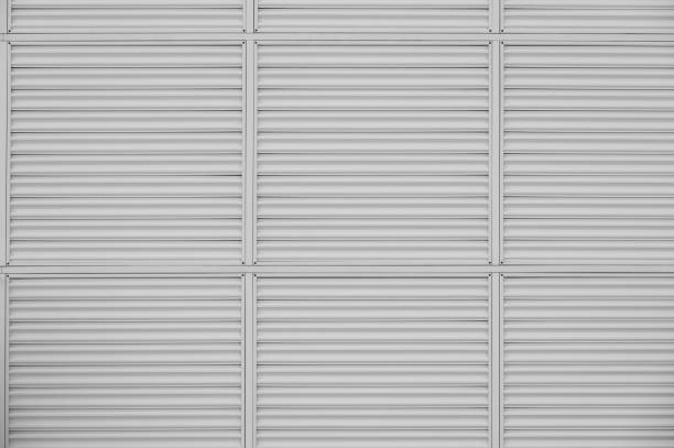 istock Gray metal shutter panels with horizontal ridges 2174002050