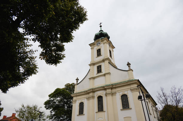 istock Church tower with clock amidst autumn trees and traffic lights 2174002113