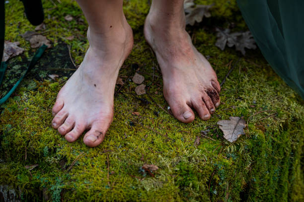 istock Barefoot on mossy stump. Shallow depth of feld 2174008126