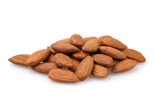 istock A pile of almonds isolated on white background 2174008516
