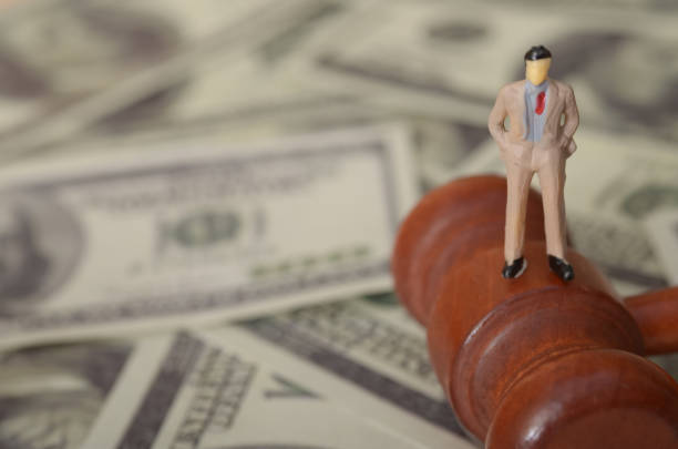 istock The image could symbolize the relationship between wealth and justice, or the potential for financial corruption. 2174011977