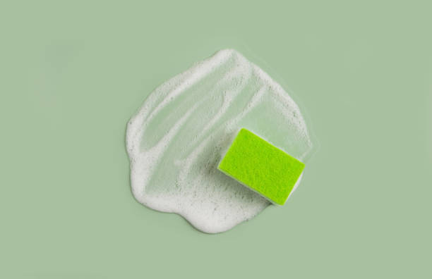 istock Washing Sponge lying on surface in soapy foam 2174012227