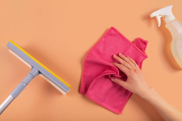 istock Set for cleaning windows and other surfaces on orange background 2174012244