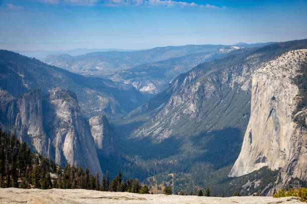 Breathtaking view of Yosemite Valley from Sentinel Dome, showcasing iconic granite cliffs, forested slopes, and the vast wilderness of one of America's most beloved national parks.