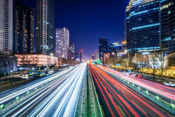 Urban Pulse: Night Traffic in Modern Cityscape