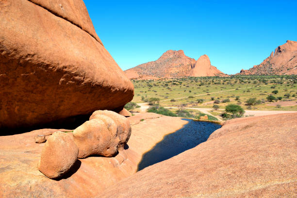 istock Spitzkoppe area with beautiful rock formations, arches, lakes between rocks in Damaraland Namibia 2174017595