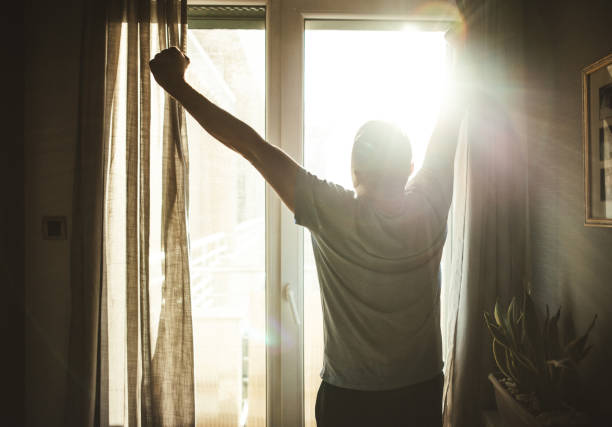 istock Man Looking Out of Window 2174022212