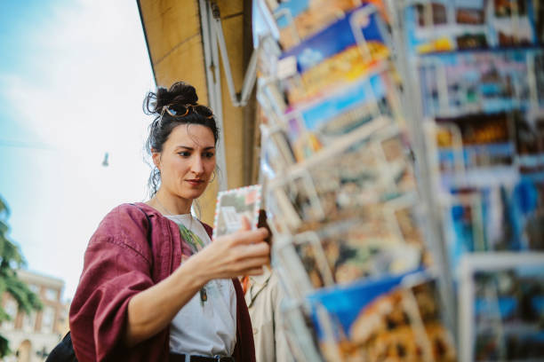 istock shopping for postcards in Verona, Italy 2174023749