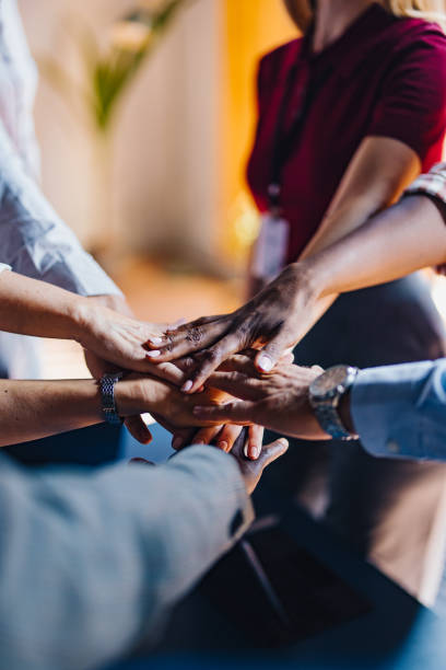 istock Diverse Team Joining Hands in a Unified Gesture 2174029696