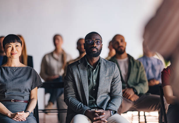 istock Diverse Audience Engaged in a Business Presentation 2174029722