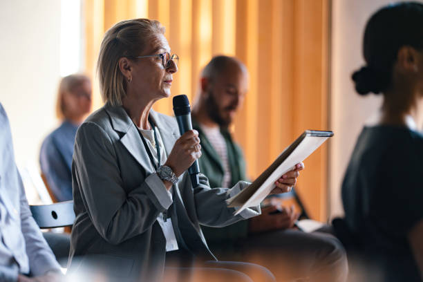 istock Business Seminar With Speaker Engaging Audience Participation 2174029755
