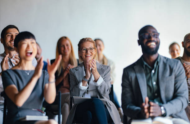 istock Diverse Audience Clapping at Business Conference Event 2174029762