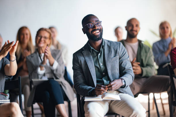 istock Diverse Audience Applauding at Business Conference Speech 2174029771