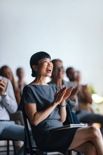 istock Enthusiastic Business Audience Applauding at Professional Event 2174029778