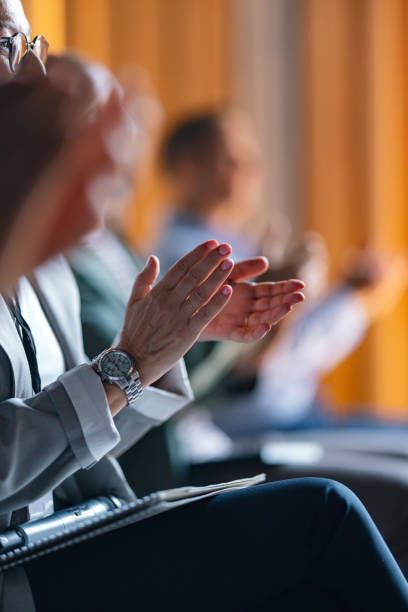 istock Business Professionals Applauding at a Corporate Event 2174029794