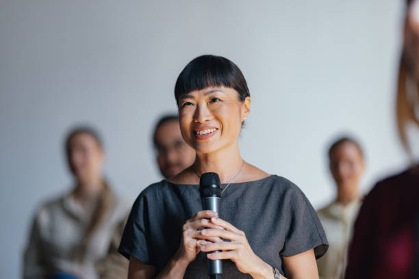 istock Confident Woman Speaking at a Professional Event 2174029812