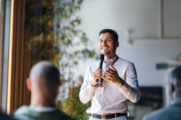 Confident Speaker Engaging Audience at Business Event