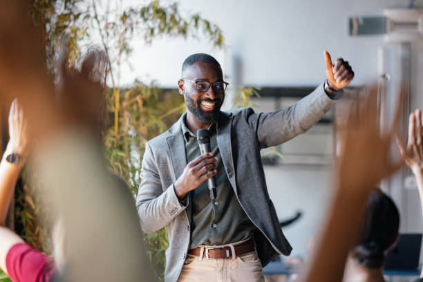 istock Motivational Speaker Engaging Audience at a Business Event 2174029858
