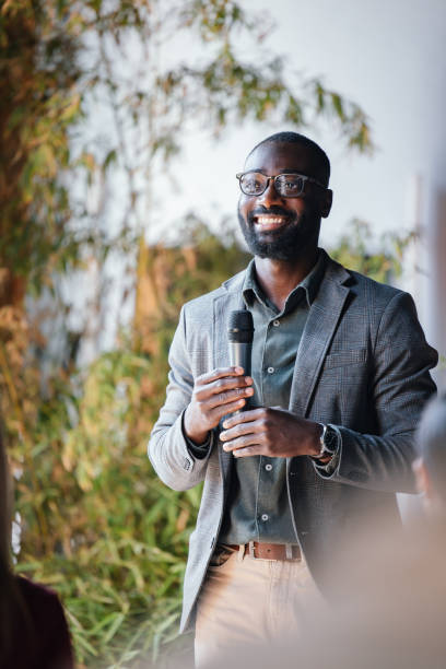 istock Confident Businessman Giving a Presentation at Corporate Event 2174029875