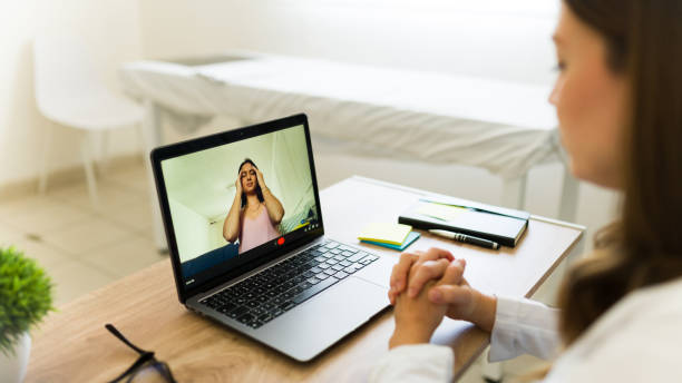 istock Doctor is having a video call with her patient who is describing her symptoms 2174030421