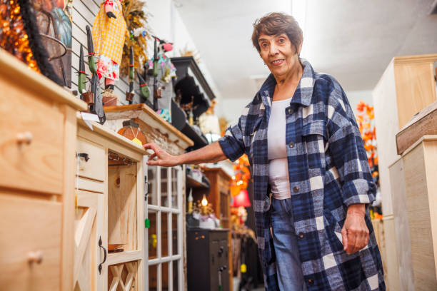 istock Senior woman explores eclectic collection in Poconos shop. 2174033045
