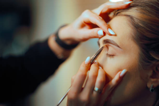 istock Make-up Professional Correcting with Concealer the Shape of the Eyebrows 2174034170