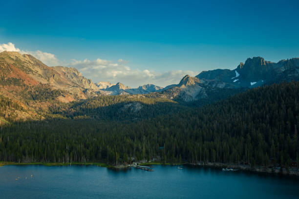 Small  Fishing Boats on Lake George With Crystal Crag and Mammoth Crest in the Distance, Mammoth Lakes, California, USA