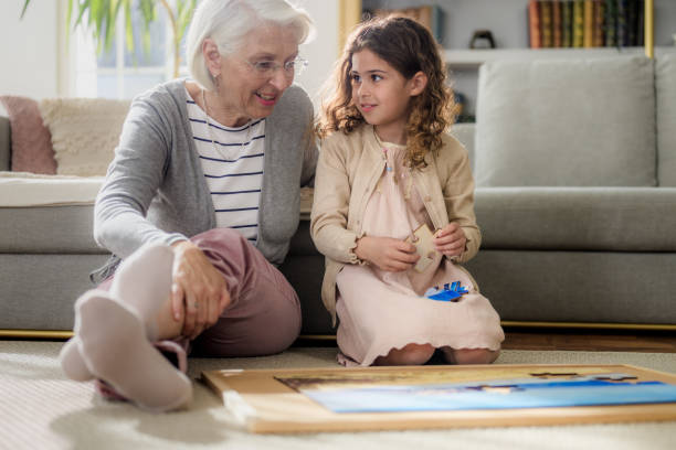 istock Intergenerational Puzzle Time in Cozy Living Room 2174039650