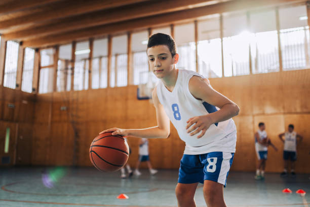 istock Focused young basketball player with number 8 2174040459